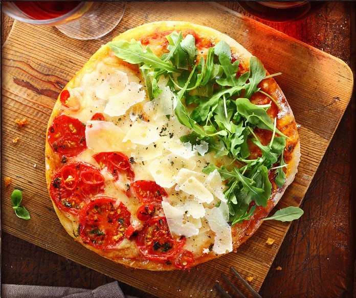 Freshly baked pizza on a wooden board